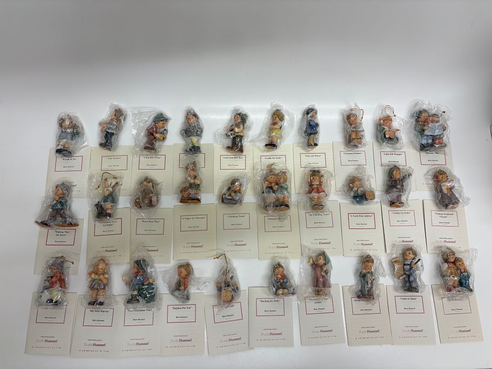 Lot 119: A Collection of 28 Goebel Berta Hummel StudioHummel Christmas Figurines