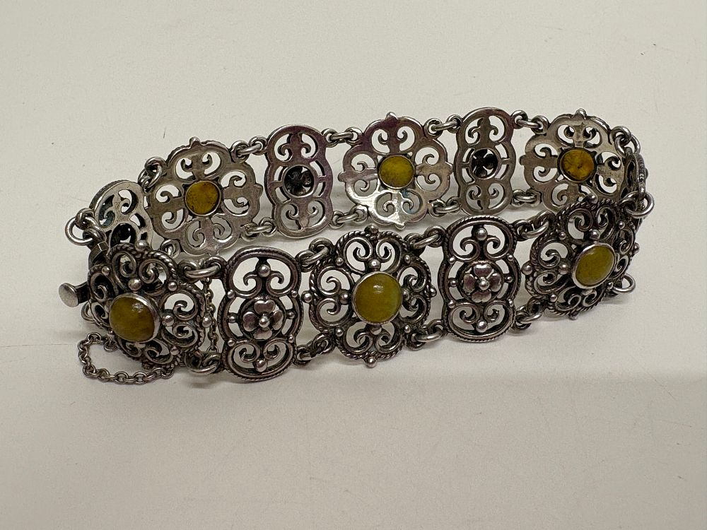 Lot 45: A Silver Filigree Link Bracelet Set with Green Stone Cabochons gross circa 22.9g