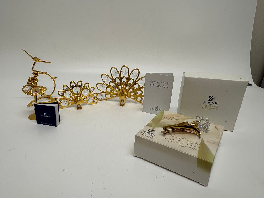 Lot 744: A Collection of Swarovski Gold-Plated and Crystal Decorative Figurines and Brooch