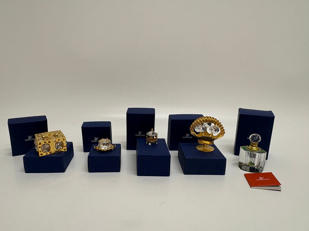 Lot 745: A Collection of Swarovski Crystal Memories Figurines and Perfume Bottle