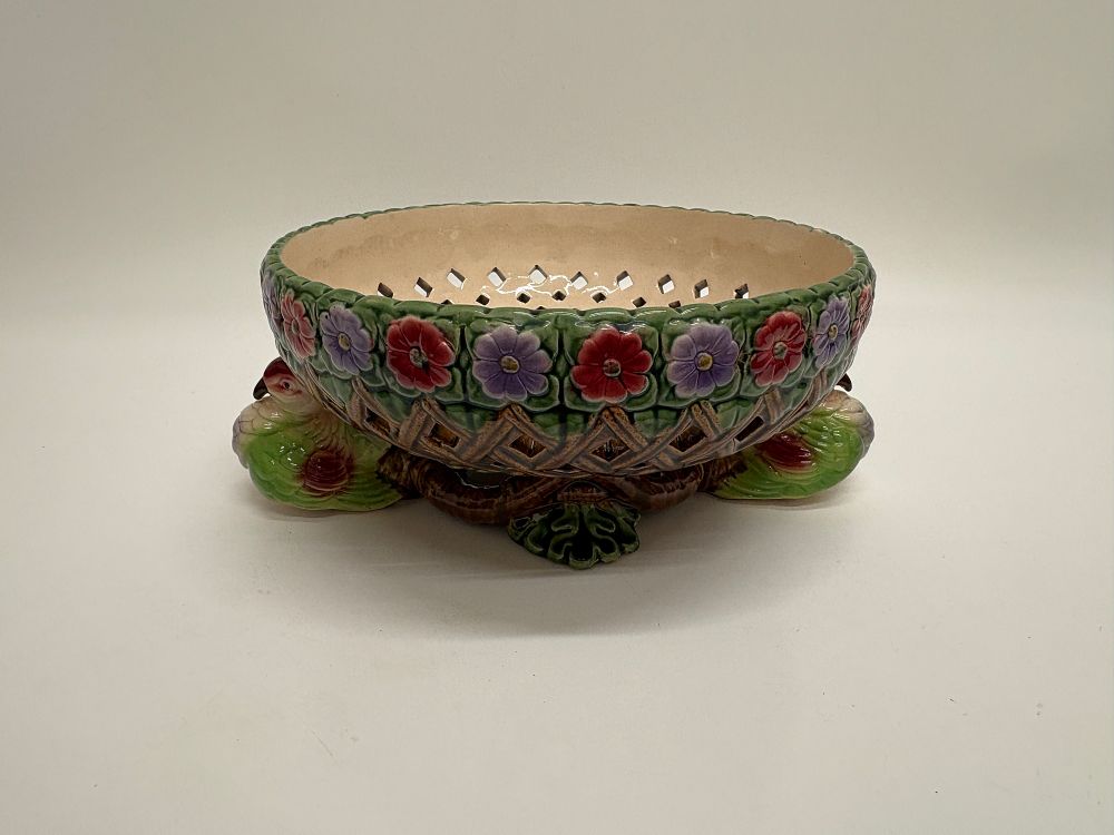 Lot 750: A Footed Majolica Centerpiece Bowl with Reticulated Basketweave and Waterfowl Base