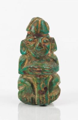 Moche Chavin Pendant (Green Deity). This pendant is in the shape of a diety wearing a helmet and