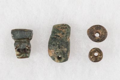 Pre-Columbian Jade Pendants / Beads. The shapes include hatchet, cat's head, and 2 rounds. The