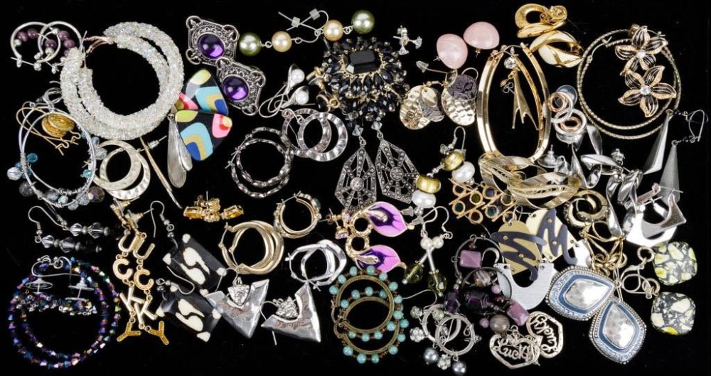 Earrings & More Earrings. Over 40 pair of pierced earrings featuring a pair of iridescent 