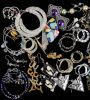 Earrings & More Earrings. Over 40 pair of pierced earrings featuring a pair of iridescent Image - 3