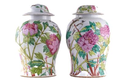 Pair of Chinese Floral Vases. A pair of Chinese floral vases, each with a story or poem on the 