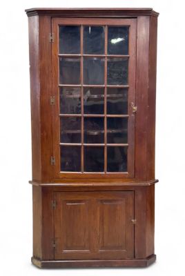 Early 19th C. 1 Piece Corner Cupboard. An early 19th century glass cover corner cupboard with 