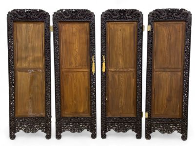 Decoratively Carved Asian Screen. A decoratively carved Asian screen depicting dragons and bats 