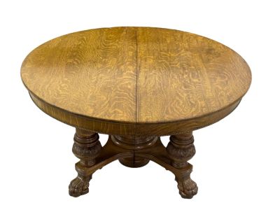 Oak Banquet Table w/ 8 Leaves. An oak banquet table with 8 leaves (2 not original). Has claw 