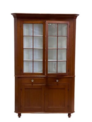 Two Piece Corner Cupboard 19thC. A two piece corner cupboard w original paint and key. Intact 