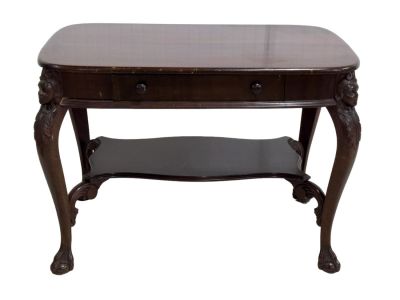 Hall Table w/ Figural Carvings. An Early 20th century hall table with beautiful carvings on each 