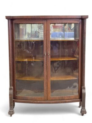Wood Display Cabinet w/ Mirror. 20th century wooden display cabinet, with claw feet and rollers. 