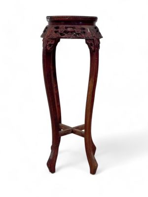 Plant Stand with Carvings and Marble Top. A plant stand with marble top and floral carvings. 