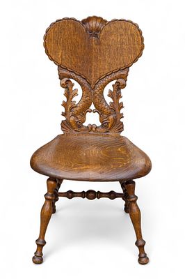 Antique Oak Carved Side Chair. Antique oak carved side chair with dolphin motifs. Measures 