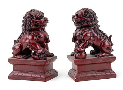 Cinnabar Fu Lion Statuettes. A pair of heavy cinnabar male and female Fu lion statuettes, marked 