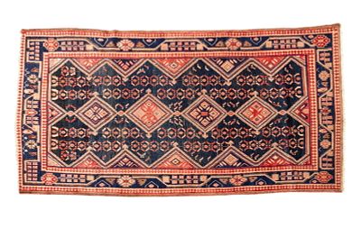 Oriental Rug ~5' x 9' Red and Black. Rug measuring approx. 9' x 5'1". Condition: Rugs may be 