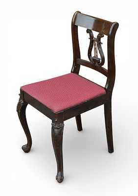 Lyre Back Chair. Wooden sidechair featuring a lyre back and white and red polka-dot upholstery. 