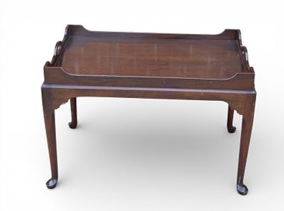 Queen Anne-Style Tea Table. Queen Anne-style wooden tea table measuring approx. 19.5" H x 31" W 