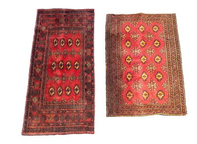 2 SA Bokhara Rugs. 2 semi-antique Bokhara rugs. Larger measuring approx. 3'1" x 2'2". Condition: 