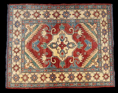 Pakistani Kazak Area Rug. Pakastani Kazak area rug measuring approx. 5'1" x 4'. Condition: Rugs 
