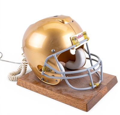 Football Helmet Telephone on Wooden Base. Football helmet-shaped telephone featuring a 