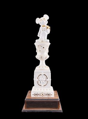 Mickey Mouse Porcelain Cheese Award. Porcelain Mickey Mouse figure atop an ornate base with 