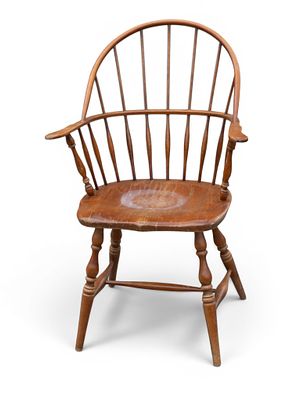 Windsor Bow Back Arm Chair. A Windsor bow back spindle armchair. Some loss to finish on the 