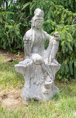 Asian Seated Kwan Yin Stone Garden Sculpture. Solid carved granite garden sculpture depicting 
