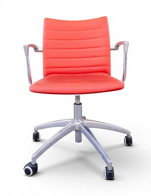 Chrome Swivel Chair with Red Faux Leather Uph. A modern office chair featuring a chrome frame 