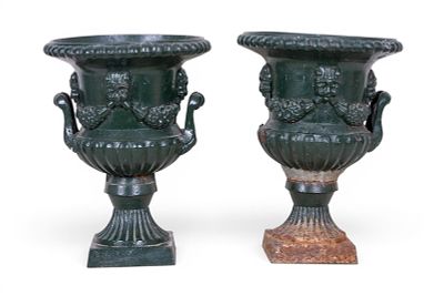 Pair of Cast Iron Garden Urns. Pair of cast iron gardens urns, each having a scalloped rim 