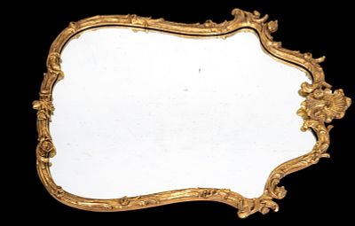 Vintage Decorative Arts Carved Gilt Wood Mirror. An ornately carved and gilt wood wall mirror by 