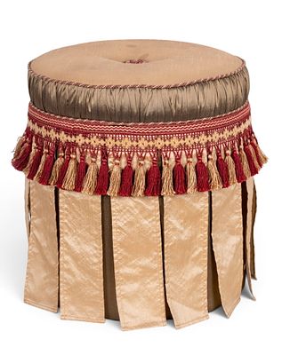 Bombay Tasseled Ottoman Stool. An ottoman / footstool by Bombay featuring a fabric strip skirt 