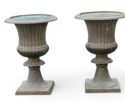Pair of Cast Iron Garden Urns. Pair of cast iron garden urns with fluted and curved rims. Each 