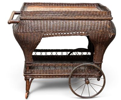 Early Wicker Serving Cart w/ Tapestry Accent. An early dark brown wicker tea trolley / serving 