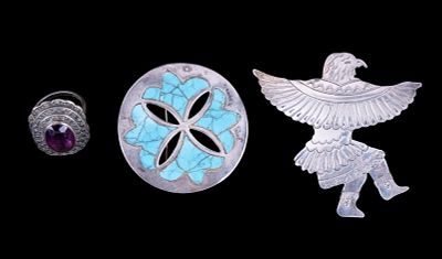 Taxco and Navajo Sterling Jewelry. A Taxco sterling brooch with turquoise inlay, an etched 