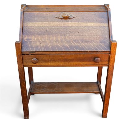 Victorian Oak Slant Front Desk. A Victorian oak slant front desk featuring a carved butternut 