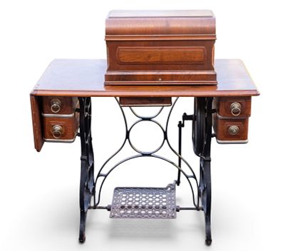 19th C Standard Sewing Machine and Table. A 19th C pedal powered sewing machine by the Standard 