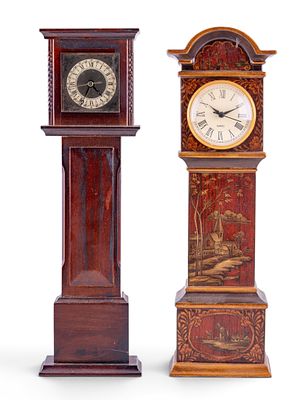 Two Miniature Grandfather Clocks. Two decorative miniature longcase clocks in stained wood cases 
