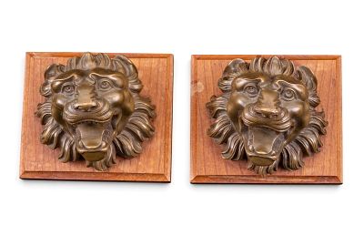 Pair of Solid Bronze Lion Head Mounts. Pair of solid bronze lion head mounts, each modeled with 