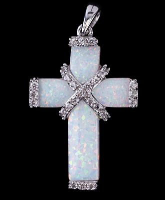 Opal Cross Pendant. Sterling silver and opal cross pendant with cubic zirconia accents. 