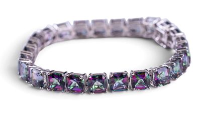 Mystic Topaz Bracelet. Sterling silver tennis bracelet set with 25 Mystic Topaz stones. 