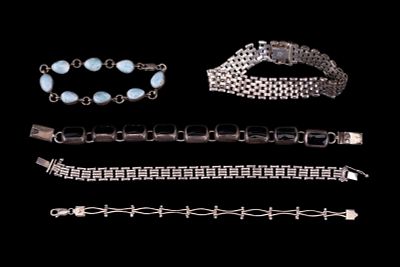 5 Silver Bracelets. Five distinct silver chain and link bracelets with a combined weight of 