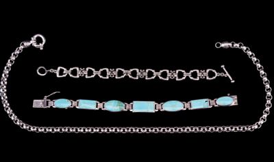 2 Silver Bracelets & A Silver Necklace. A sterling silver link bracelet featuring distinct 