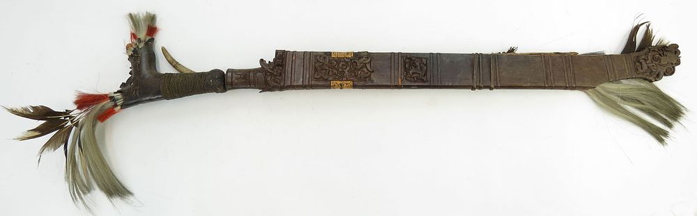 Lot 156: A DAYAK HEADHUNTER PARANG IHLANG OR MANDAU SWORD