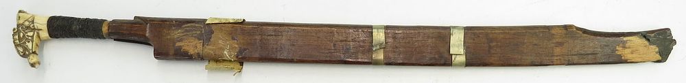 Lot 234: A DAYAK HEADHUNTER PARANG IHLANG OR MANDAU SWORD
