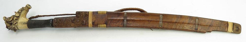 Lot 256: A DAYAK HEADHUNTER PARANG IHLANG OR MANDAU SWORD