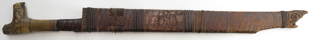 Lot 297: A DAYAK PARANG IHLANG MANDAU SWORD