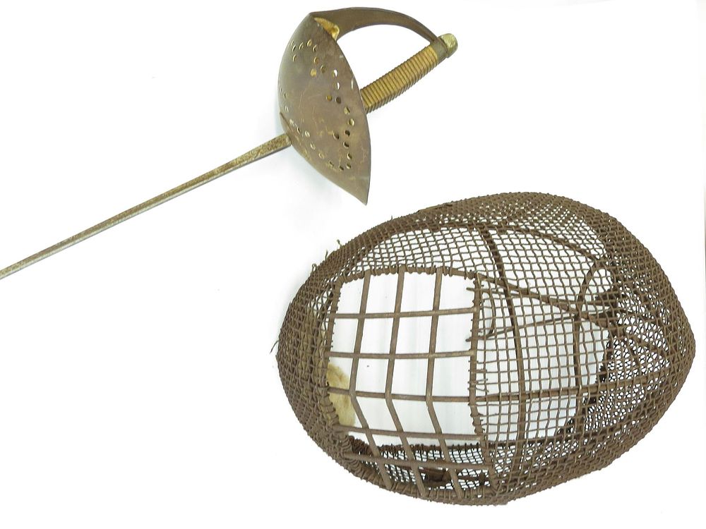 Lot 389: A FENCING SABER AND MASK