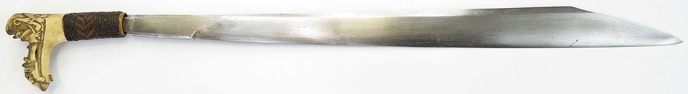 Lot 243: A DAYAK HEADHUNTER MANDAU SWORD