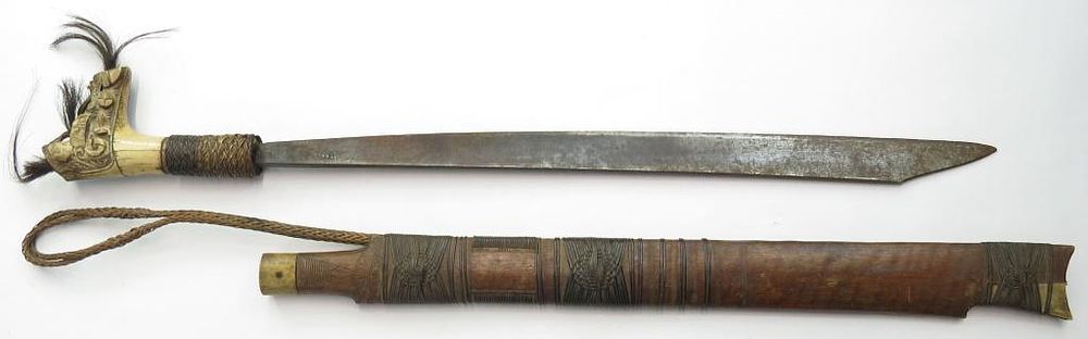Lot 344: A DAYAK HEADHUNTER MANDAU SWORD